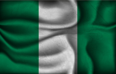 Obraz premium crumpled flag of Nigeria on a light background