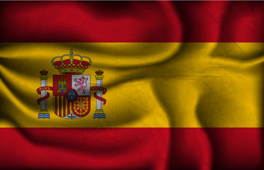crumpled flag of Spain on a light background