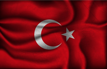 crumpled flag of Turkey on a light background