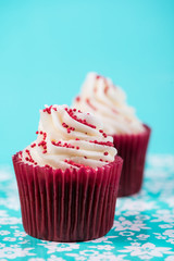 red and pink cup cake on blue background
