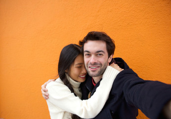 Happy man and woman taking a selfie