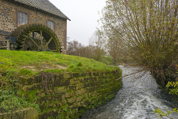 Waterwheel in a stream at fall