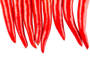 Naklejka premium Red chili peppers over white background