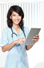 Beautiful doctor using tablet computer