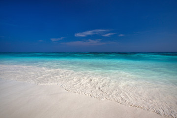 beach with clear waters and white fine sand