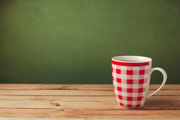 Cup of tea on wooden table with copy space