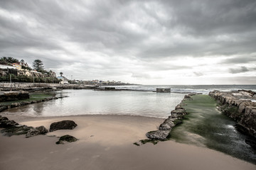 Cascais embankment at low tide. dramatically