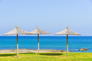 Fototapeta premium parasol of straw on the sea