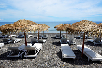 The beach with black volcanic stones at Santorini island, Greece