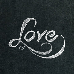 the word love on the chalkboard - 74153704