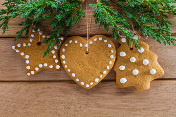 Christmas homemade gingerbread cookies over wooden table