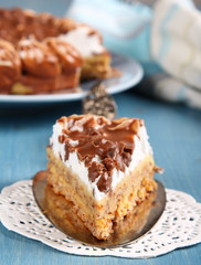 Slice of almond cake with chocolate and cream