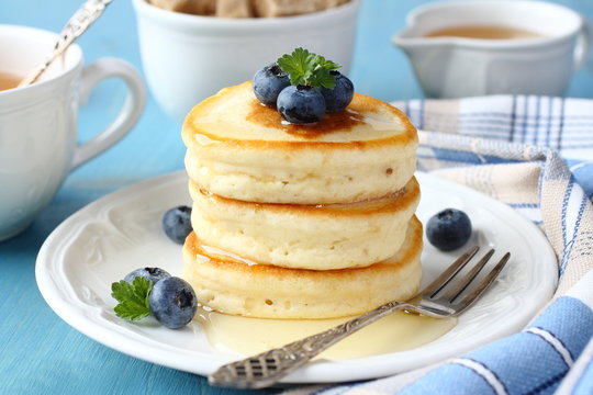 A Stack Of Scotch Pancakes With Blueberries