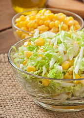Chinese cabbage salad with sweet corn in a glass bowl