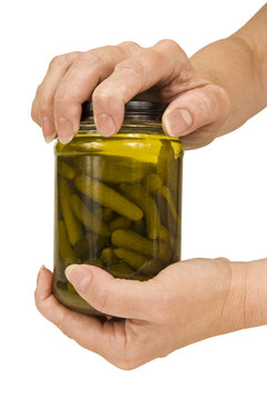 Woman’s Hands Opening Pickle Jar