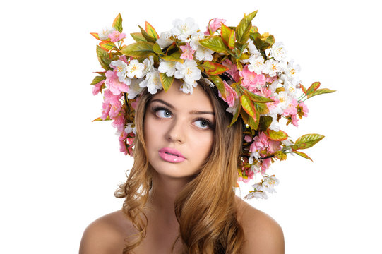 Beautiful woman with a wreath of flowers
