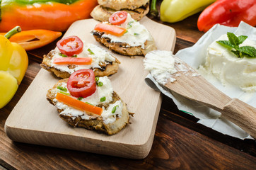 Healthy baguette, spread curd cheese with vegetable and herbs