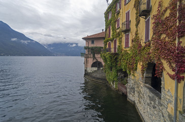 Fototapeta na wymiar Old houses near the water. Lake Como, Italy.