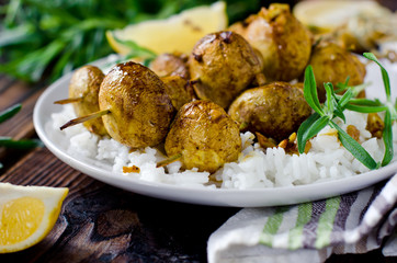 Skewers of mushrooms with a side dish of rice
