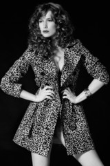 Pretty red-haired girl with curls, pantera coat black and white © Anna Huzarska