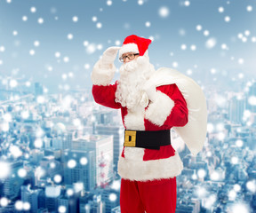 man in costume of santa claus with bag