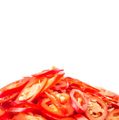 Cut slices of red chili pepper on white background