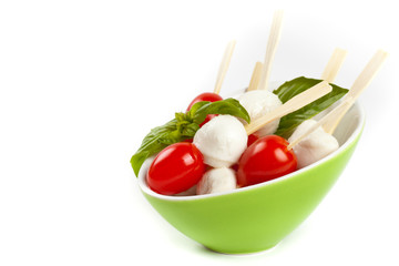 Caprese sticks on white background. Selective focus.