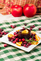 Cranberry sauce on plate with red apples