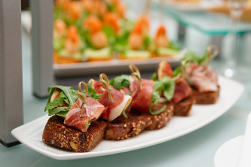 Snacks with parma ham and figs