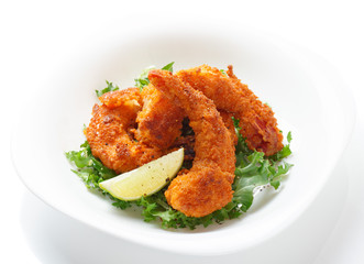 Deep fried shrimps on white plate