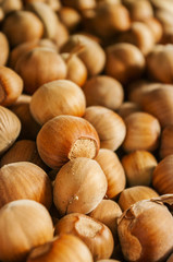 Hazelnuts, filbert on old wooden background