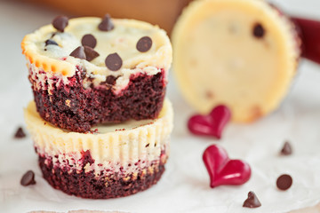 Irresistible red velvet mini cheesecakes with heart decoration