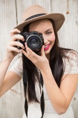 Pretty brunette taking a photo