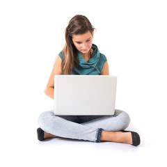 Teenager girl working with her laptop