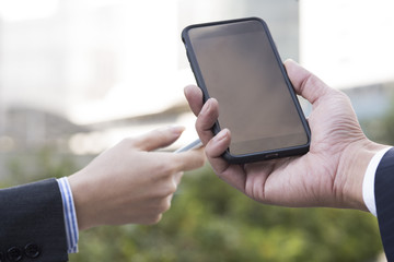 Businessmen have a cell phone of a new model