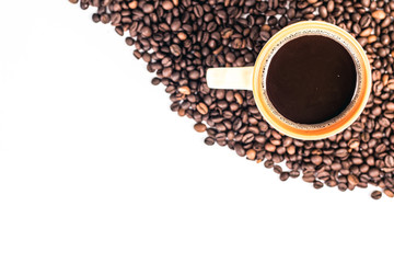 Orange cup of coffee on a background coffee beans
