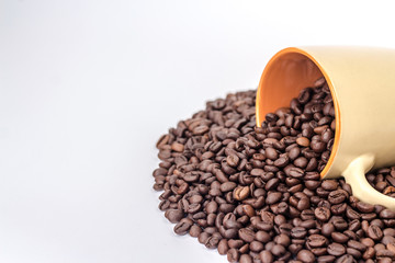 orange cup with coffee beans
