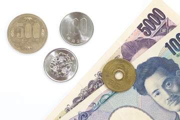 close up of japanese currency yen coins and bank notes
