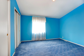 Emtpy bright blue bedroom interior