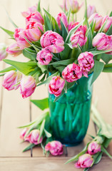 Bouquet of beautiful pink tulips in vase