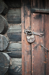 Old wooden door with metallic doorlock
