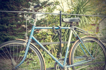 Fototapeta na wymiar Old Bike on the gate vintage