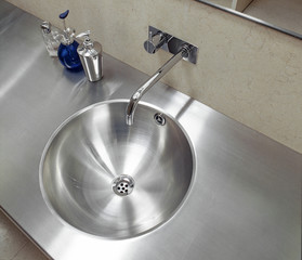a steel washbasin in a modern bathroom