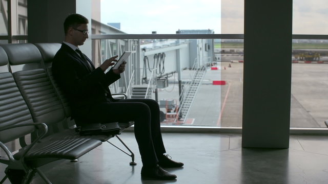 Businessman in Airport Waiting Room