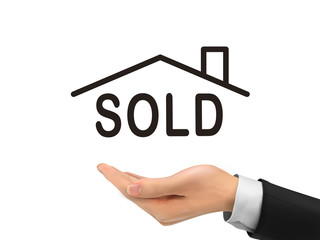 sold house word holding by realistic hand