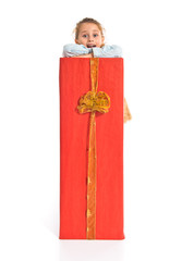 Fototapeta premium Blonde little girl holding a big red gift
