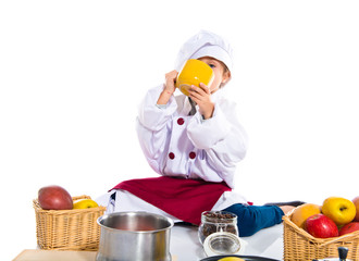 Girl dressed like chef  holding a cup of coffee