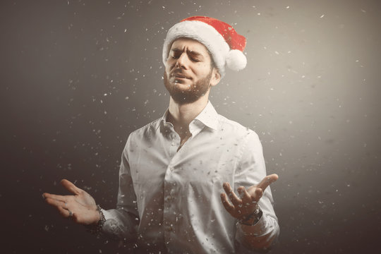 Handsome bearded young man with christmas hat portrait