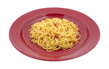 A serving of Chow Mein noodles on a red plate