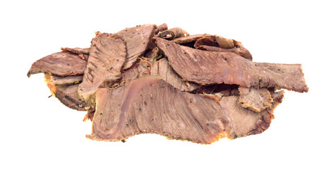 Leftover chuck roast sliced thin on a white background